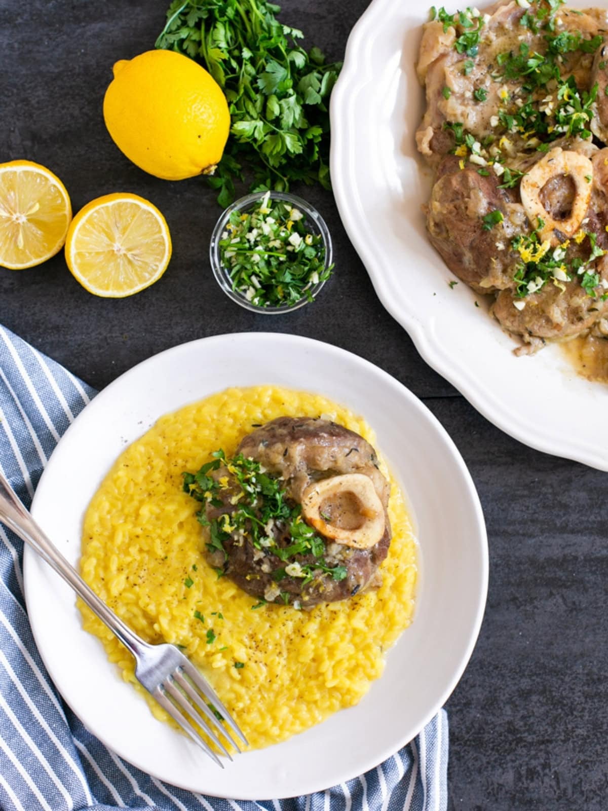 Ossobuco alla Milanese served with saffron risotto alla Milanese