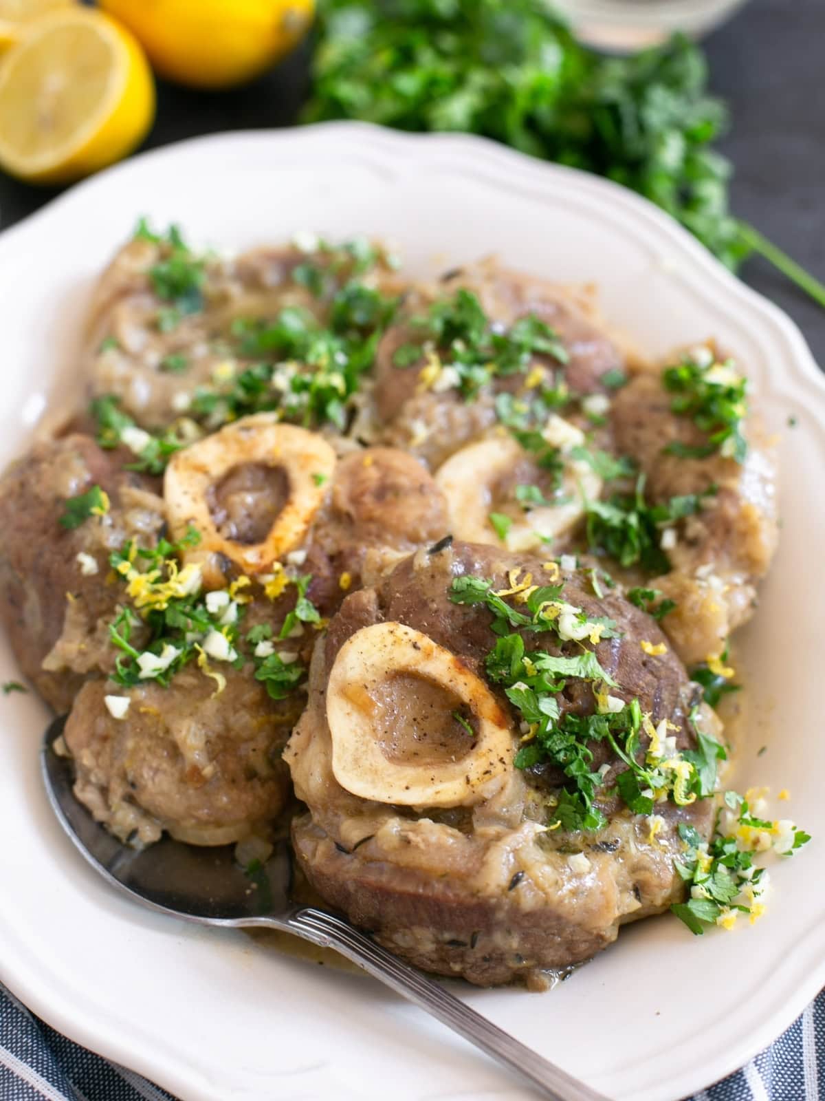 Ossobuco topped with fresh gremolata, lemon zest, and parsley