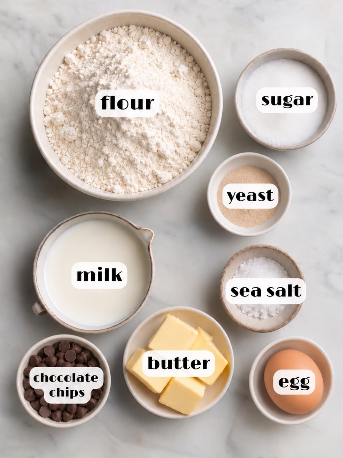 Ingredients for pangoccioli: flour, sugar, yeast, milk, sea salt, butter, chocolate chips and an egg